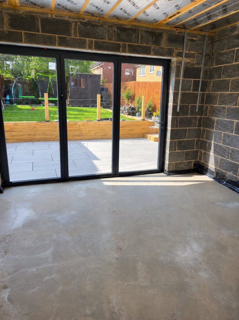 Internal shell of extension with glazing and garden view